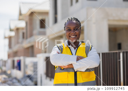 Portrait smart success black women worker african female work in construction industry happy smile in construction site. 109912745