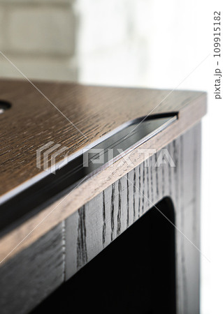 Mobile phone with wireless charger on table. Modern workplace accessory 109915182