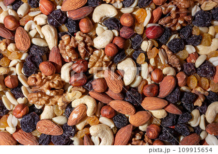 Mixed Nuts: Almonds, Walnuts, Cashews, Peanuts, Hazelnuts, Dried Prunes and Raisins 109915654