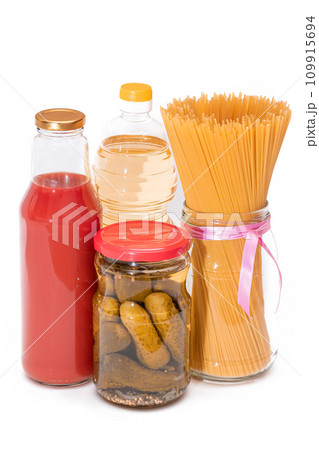 Food Reserves: Canned Food, Spaghetti, Pickles and Tomato Juice - Isolated on White Background 109915694