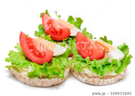 Rice Cake Sandwiches with Tomato, Lettuce and Egg - Isolated Rice Cake Sandwiches with Tomato, Lettuce and Egg - Isolated 109915695