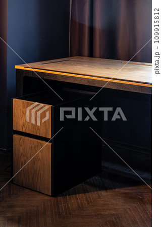 Mobile phone with wireless charger on table. Modern workplace accessory 109915812