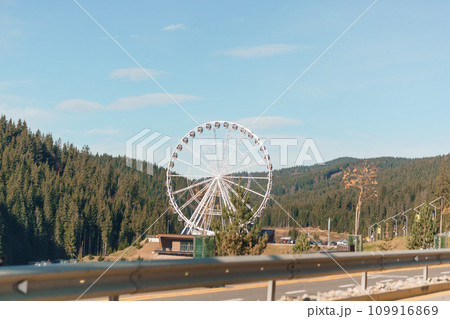 Big tall white ferris wheel in front of perfect blue sky in Bukovel. Carpathians Ukraine 109916869