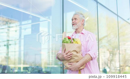 Male hugging wholesome goods assortment in package outdoors 109918445