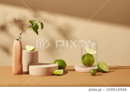 Fresh lemons and platforms of different sizes on a brown-beige background. Empty space for product display. Copy space for natural cosmetics advertising Fresh lemons and platforms of different sizes on a brown-beige background. Empty space for product display. Copy space for natural cosmetics advertising 109918986