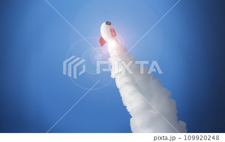 White rocket at high speed flies into space against White rocket at high speed flies into space against 109920248