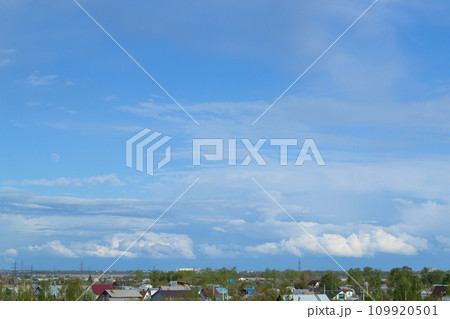 Skyscape with picturesque cumulus clouds over the countryside 109920501