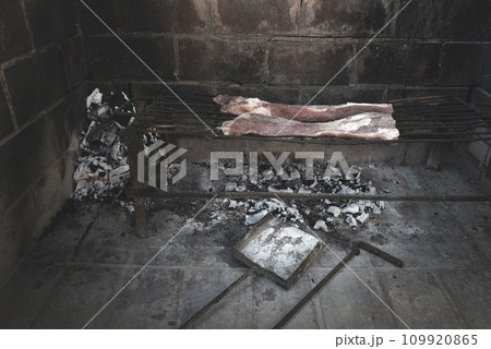 Raw meat put on the grill, traditional Argentine cuisine, Asado barbecue, Patagonia, Argentina. 109920865