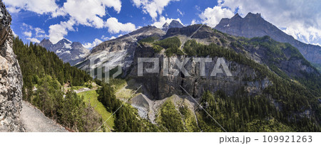 Idyllic swiss  scenery with snowy peaks of Alps mountains near Kandersteg village . Hiking route to Oeschinensee lake.  Switzerland nature 109921263