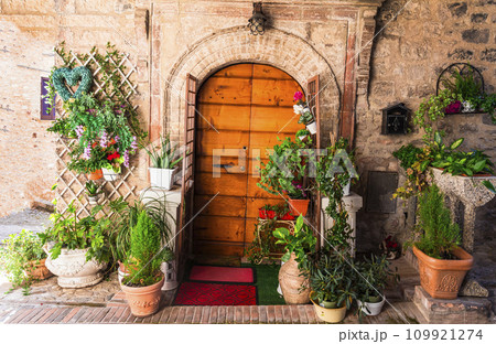 Traditional old villages of Italy, Umbria - Spello town. Charming floral streets decoration Traditional old villages of Italy, Umbria - Spello town. Charming floral streets decoration 109921274