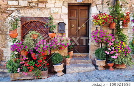 Traditional old villages of Italy, Umbria - beautiful Spello town. Charming floral streets decoration 109921656