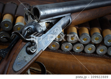 Antique 12 gauge break action smooth bored double barreled shotgun with paper cases. Antique 12 gauge break action smooth bored double barreled shotgun with paper cases. 109922889