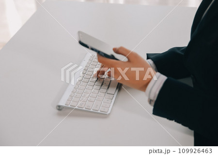 Communication support, call center and customer service help desk. VOIP headset on telephone keyboard. 109926463