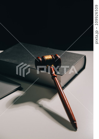 image of judge's hammer, scales lady of justice, law book, laptop computer and contract documents with pen concept of law and justice. 109926509