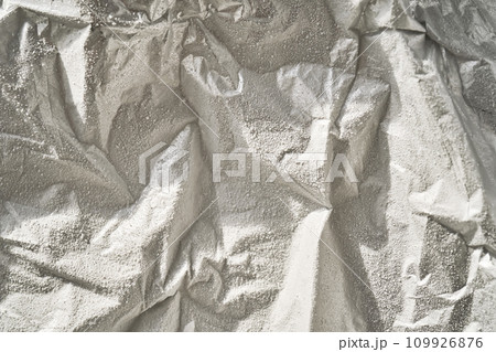Abstract background from frozen silver foil in frost. 109926876
