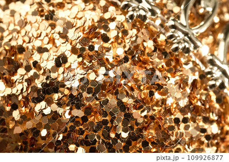 The surface of a Christmas ball in glitter close-up. 109926877