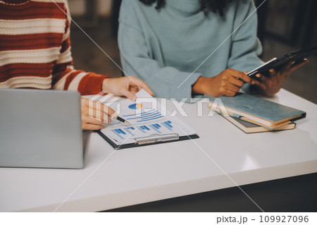 Finance manager meeting discussing company growth project success financial statistics, professional investor working start up project for strategy plan with document, laptop and digital tablet. 109927096