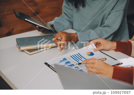 Finance manager meeting discussing company growth project success financial statistics, professional investor working start up project for strategy plan with document, laptop and digital tablet. 109927097