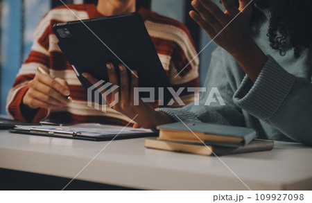 Finance manager meeting discussing company growth project success financial statistics, professional investor working start up project for strategy plan with document, laptop and digital tablet. 109927098