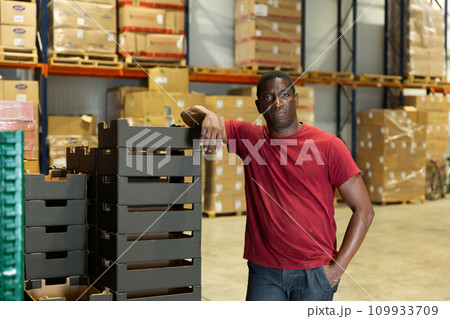 Portrait of afro man worker in warehouse Portrait of afro man worker in warehouse 109933709