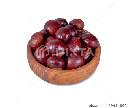Chestnut in Wooden Plate Isolated on White Background. File with Clipping Path. 109934843