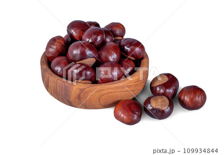 Chestnut in Wooden Plate Isolated on White Background. File with Clipping Path. 109934844