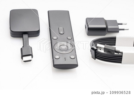 wireless internet TV set, set-top box and modern remote control, white background, selective focus, telecommunications equipment and technology concept wireless internet TV set, set-top box and modern remote control, white background, selective focus, telecommunications equipment and technology concept 109936528