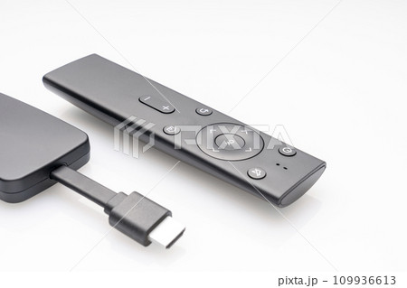 wireless internet TV set, set-top box and modern remote control, white background, selective focus, telecommunications equipment and technology concept wireless internet TV set, set-top box and modern remote control, white background, selective focus, telecommunications equipment and technology concept 109936613