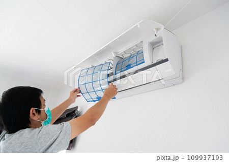 man hand hold air conditioner filter cleaning concept 109937193