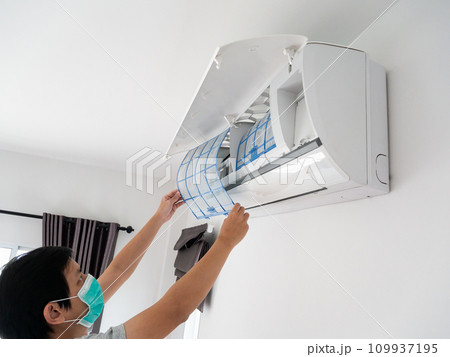 man hand hold air conditioner filter cleaning concept man hand hold air conditioner filter cleaning concept 109937195
