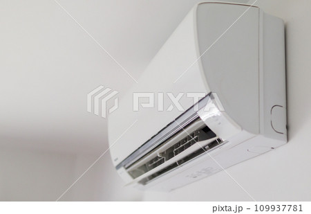 Air conditioner on white wall room interior background Air conditioner on white wall room interior background 109937781