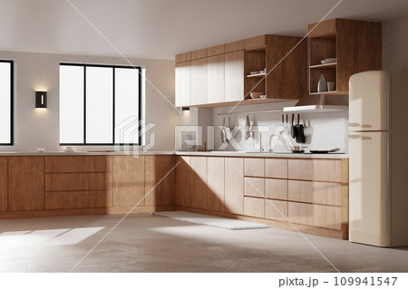 A bright beige-toned kitchen interior with sunlight coming through the window. A bright beige-toned kitchen interior with sunlight coming through the window. 109941547