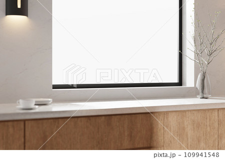 A bright beige-toned kitchen interior with sunlight coming through the window. A bright beige-toned kitchen interior with sunlight coming through the window. 109941548