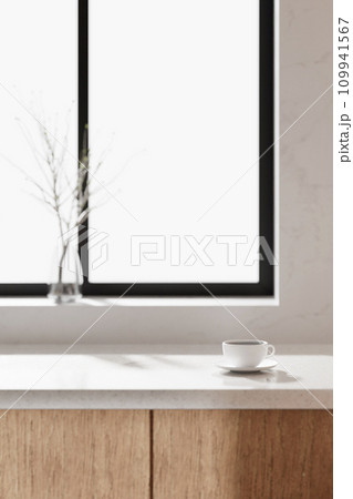 A bright beige-toned kitchen interior with sunlight coming through the window. A bright beige-toned kitchen interior with sunlight coming through the window. 109941567