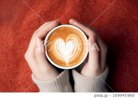 Female hands holding a cup of coffee with heart foam . Hot coffee with a heart. ai generative Female hands holding a cup of coffee with heart foam . Hot coffee with a heart. ai generative 109945960