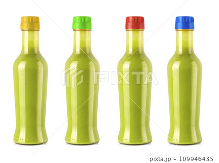 Set of bottles of hot sauce is spilling liquid on white background with clipping path Set of bottles of hot sauce is spilling liquid on white background with clipping path 109946435