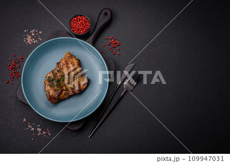 Delicious juicy beef or chicken steak with salt, spices and herbs Delicious juicy beef or chicken steak with salt, spices and herbs 109947031