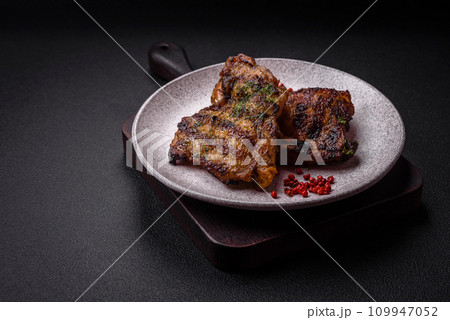 Delicious juicy beef or chicken steak with salt, spices and herbs Delicious juicy beef or chicken steak with salt, spices and herbs 109947052