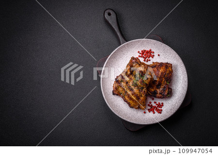 Delicious juicy beef or chicken steak with salt, spices and herbs Delicious juicy beef or chicken steak with salt, spices and herbs 109947054