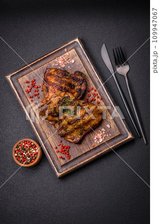 Delicious juicy beef or chicken steak with salt, spices and herbs Delicious juicy beef or chicken steak with salt, spices and herbs 109947067