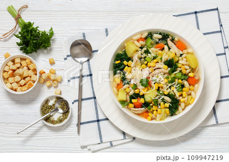 Chicken and white bean soup with veggies, corn 109947219