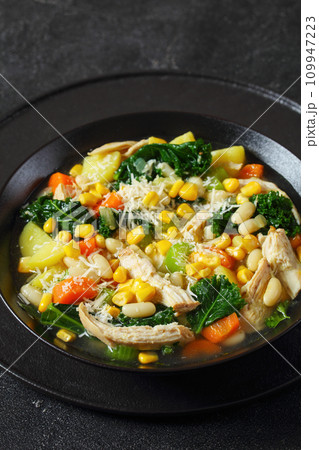 Chicken and white bean soup with veggies, corn 109947223