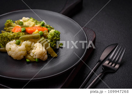 Delicious fresh vegetables steamed carrots, broccoli, cauliflower Delicious fresh vegetables steamed carrots, broccoli, cauliflower 109947268