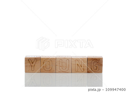 Wooden cubes with letters young on a white background Wooden cubes with letters young on a white background 109947400