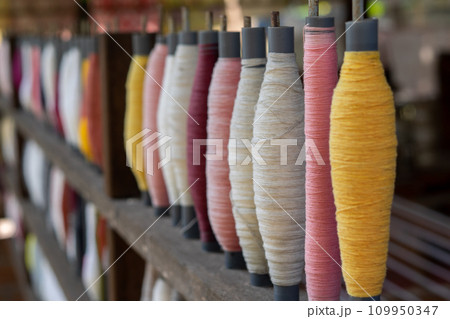 Stack of colorful silk rolls 109950347