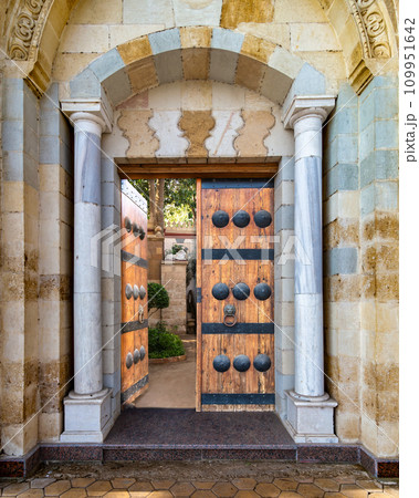 Detailed view of a intricate Mamluk style door, including dekoratif metalwork and timeworn handles 109951642