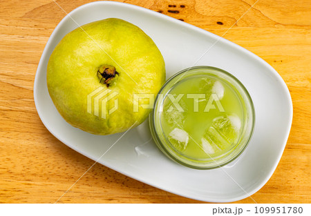 Top view of fresh cold sweet guava juice in transparent glass. Top view of fresh cold sweet guava juice in transparent glass. 109951780