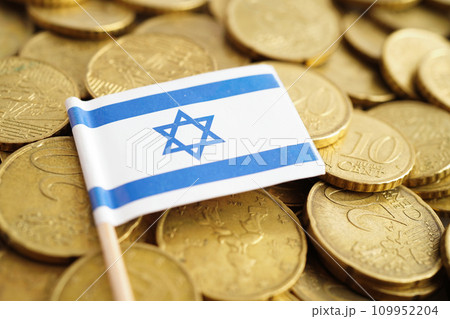 Israel flag on coins background, finance and accounting, banking concept. Israel flag on coins background, finance and accounting, banking concept. 109952204