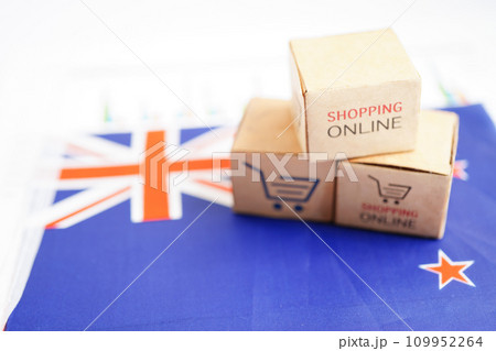 Online shopping, Shopping cart box on New Zealand flag, import export, finance commerce. Online shopping, Shopping cart box on New Zealand flag, import export, finance commerce. 109952264