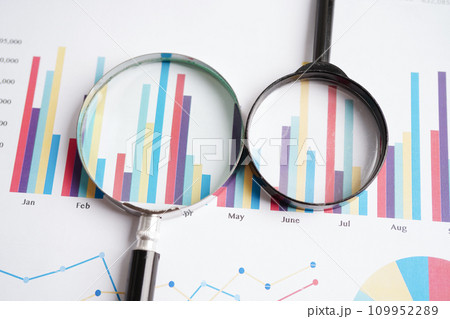 Magnifying glass on charts graphs paper. Financial development, Banking Account, Statistics, Investment Analytic research data economy. 109952289